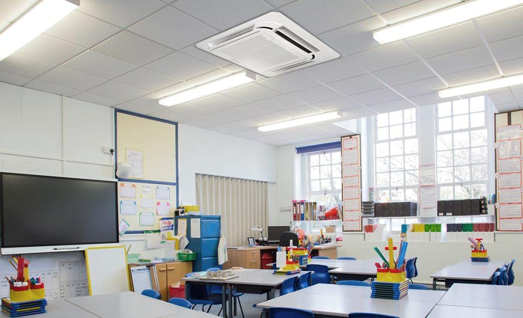 Empty Elementary Classroom With Air Vent and Commercial Lighting On the Ceiling